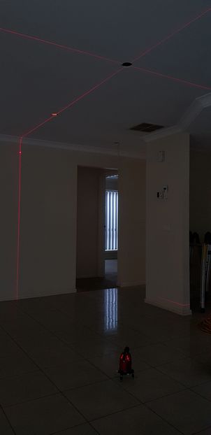 Laser level marking ceiling for downlight positions