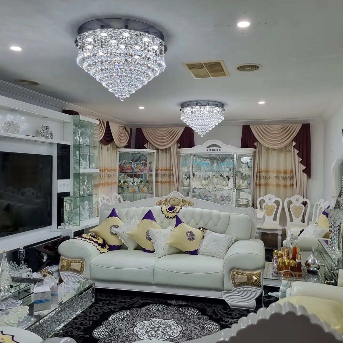 Luxury living room with dual chandeliers