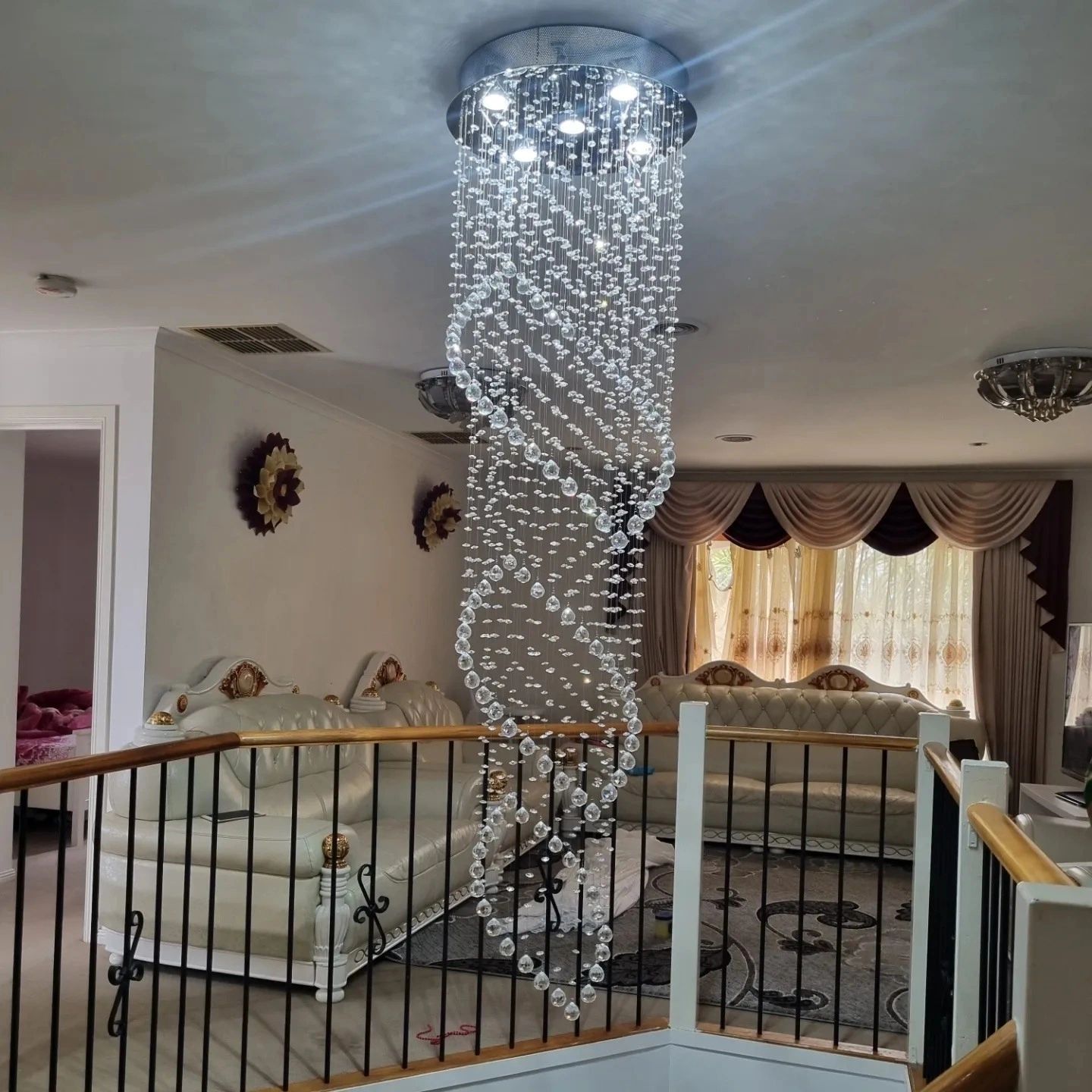 Spiral crystal chandelier luxury stairwell