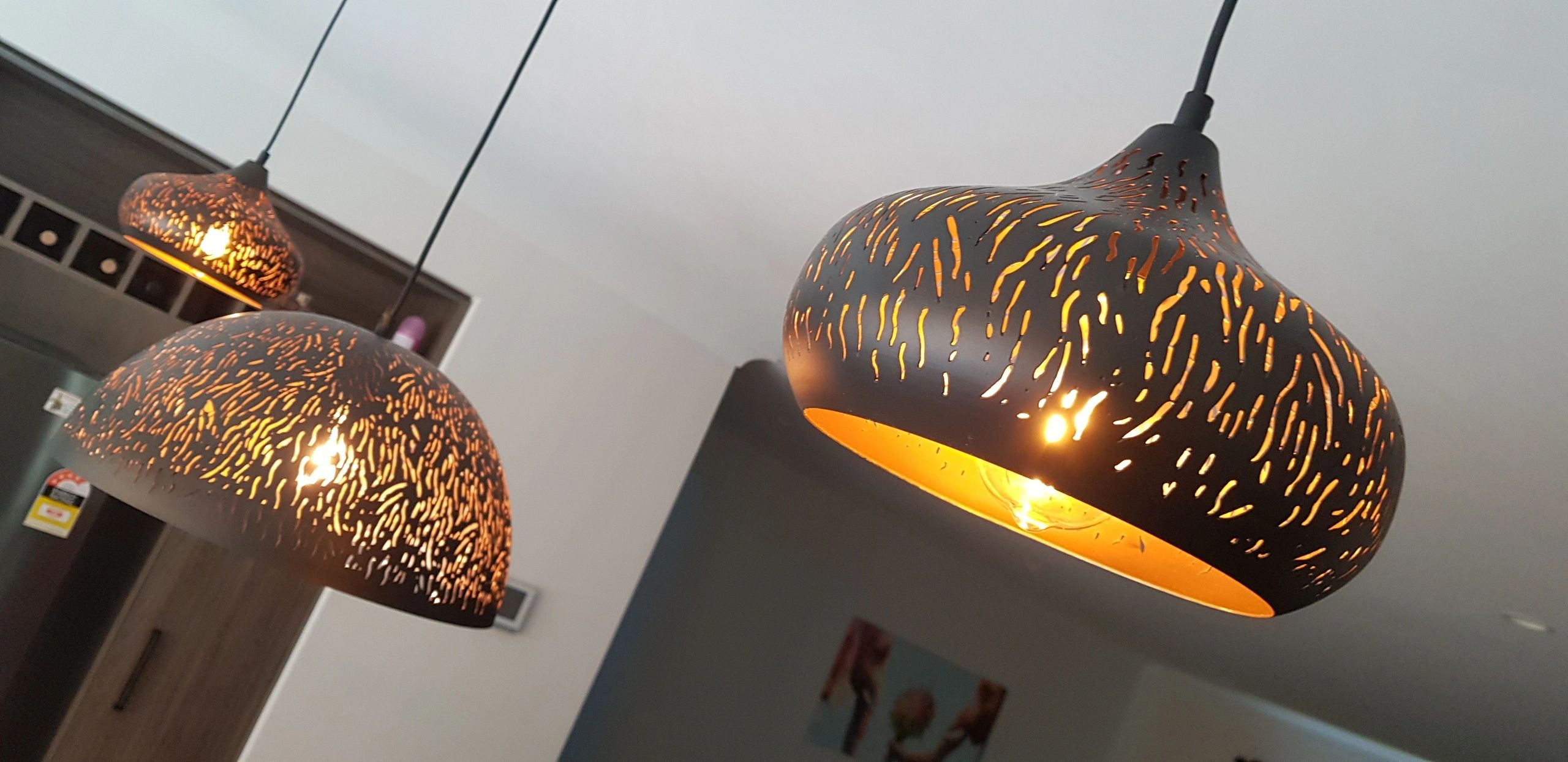 Decorative gold perforated pendant lights
